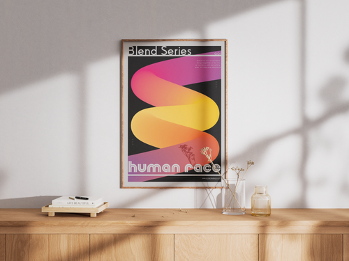 Colourful abstract poster titled 'Blend Series - human race' on a wooden side cabinet with a white wall background