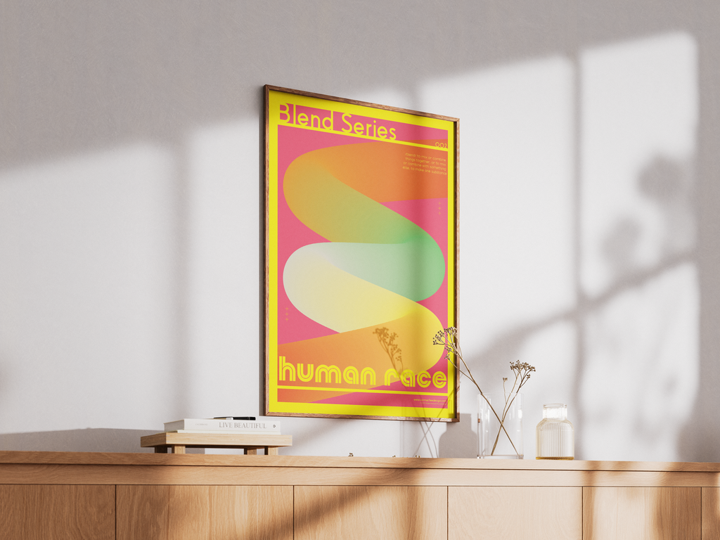 Framed poster with colorful design on a wall above a wooden surface