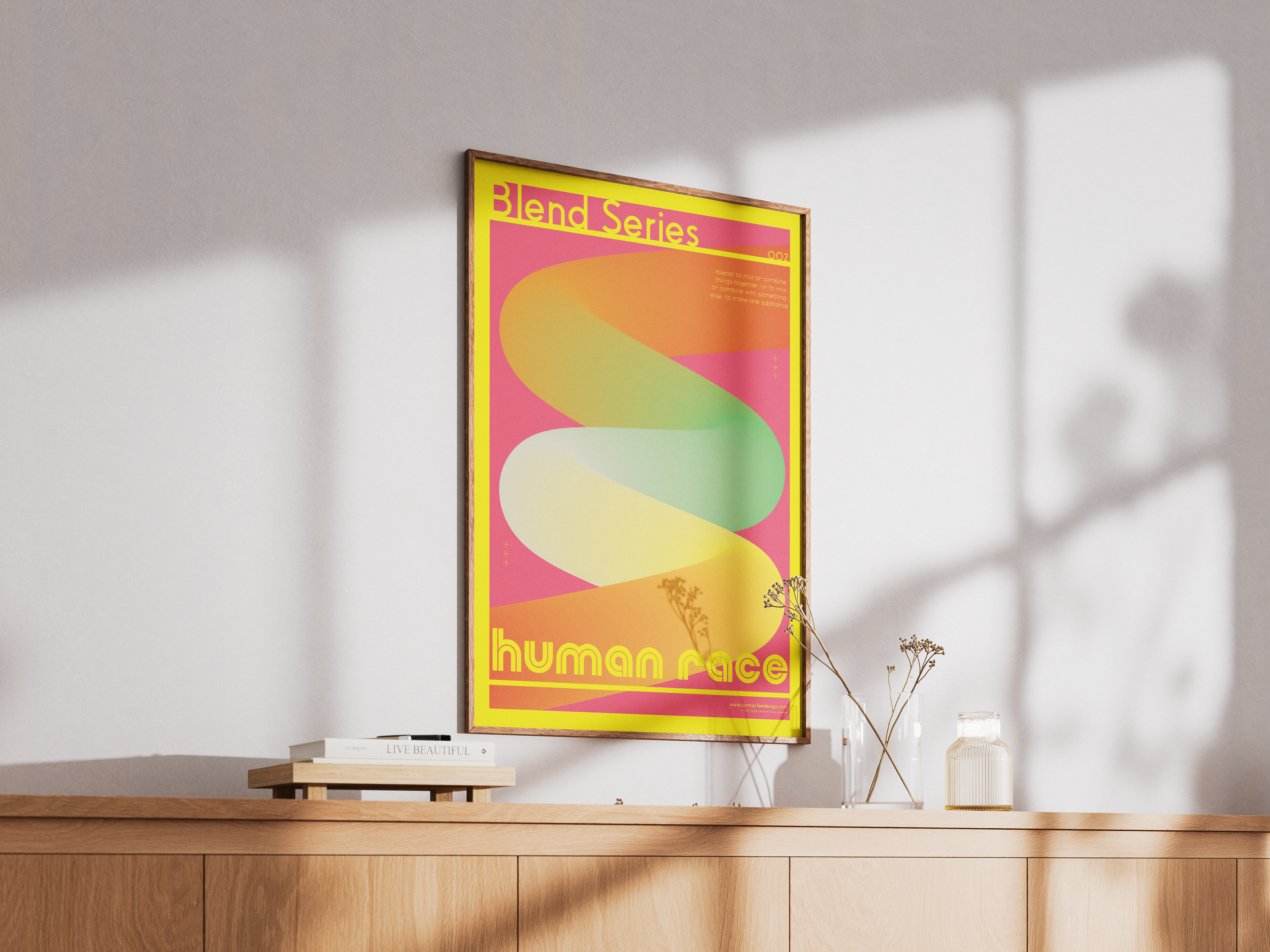 Framed poster with colorful design on a wall above a wooden surface