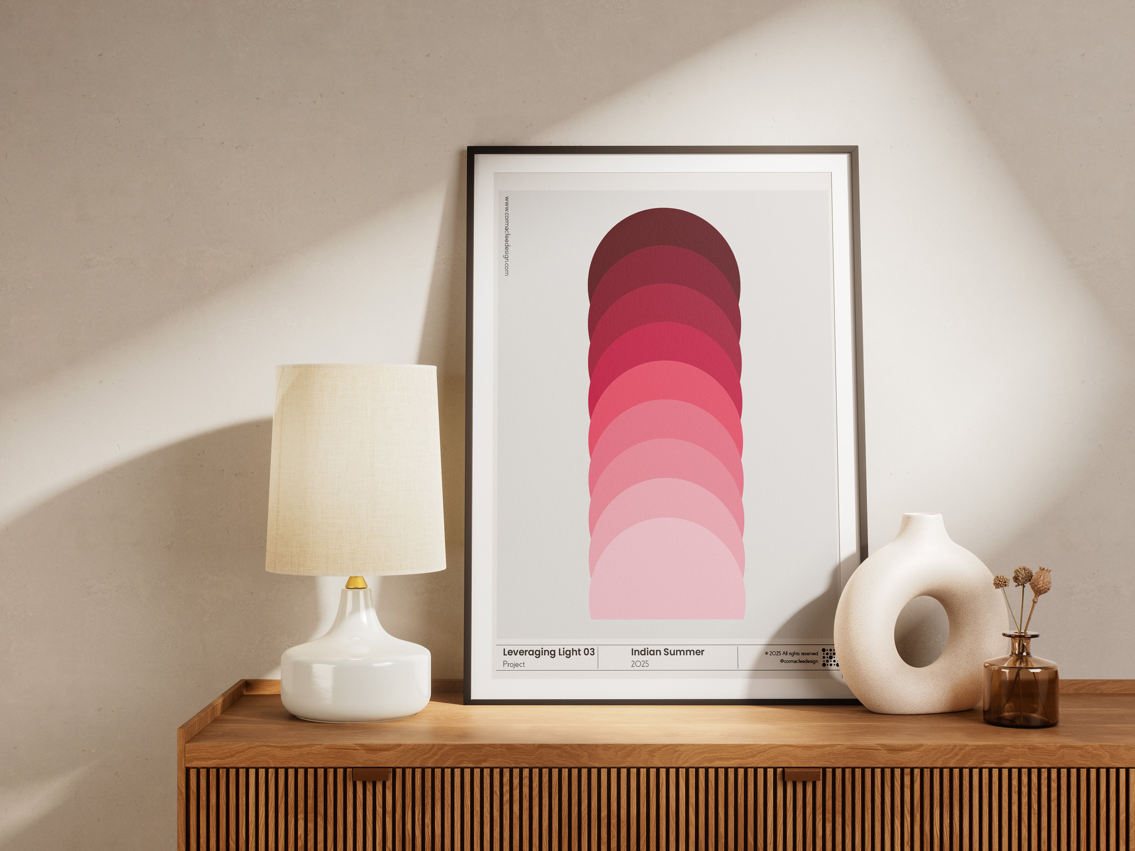 Framed abstract art print on a wooden shelf with decorative items.